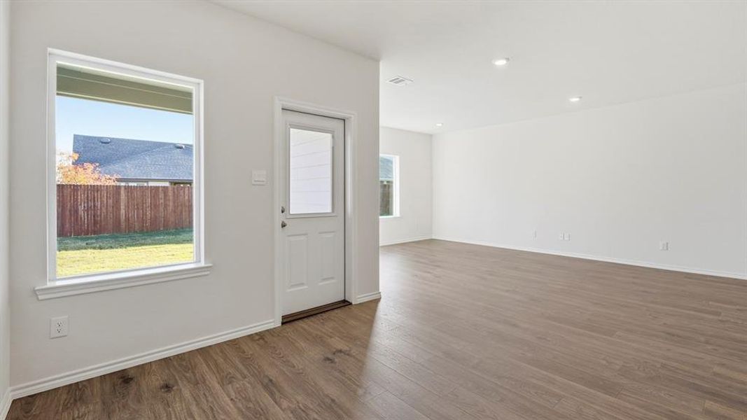 Unfurnished room featuring dark wood-style floors and recessed lighting