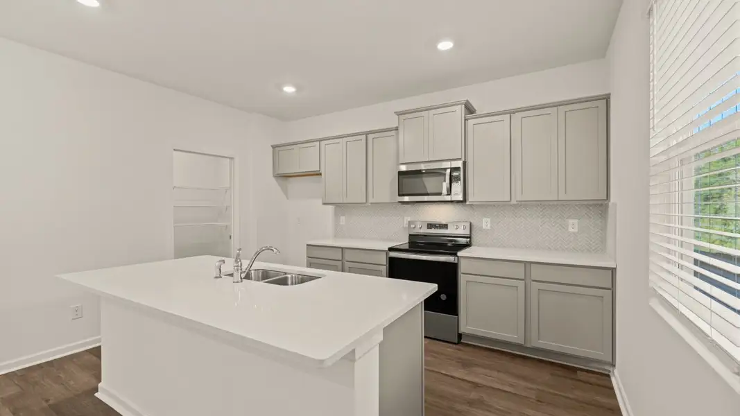 Representative furnished interior of a home built from the Galen by D.R. Horton in The Reserve at Calcutta, Stockbridge (Image 7).