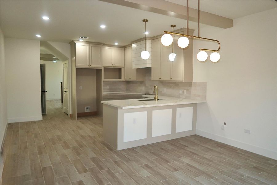 The kitchen offers a walk-in pantry, quartz countertops, stainless steel appliances—including a stove and dishwasher (not pictured) —and a convenient nook for your microwave. The kitchen offers a walk-in pantry, quartz countertops, stainless steel appliances—including a stove and dishwasher (not pictured) —and a convenient nook for your microwave.