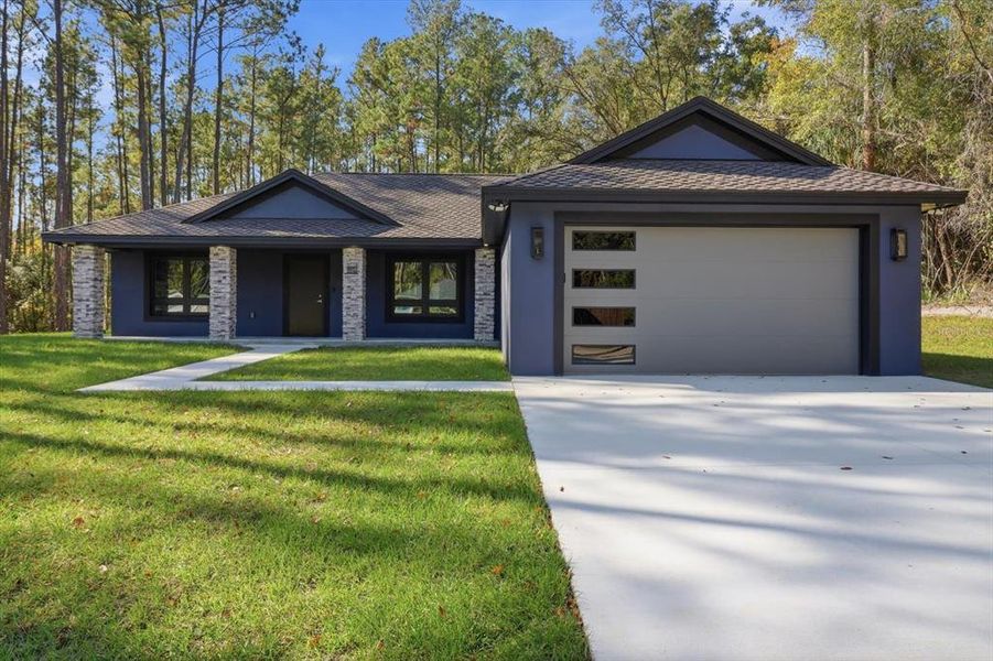 Front exterior of a new home in , Citrus Springs, FL, highlighting curb appeal (Image 2). Front exterior of a new home in , Citrus Springs, FL, highlighting curb appeal (Image 2).