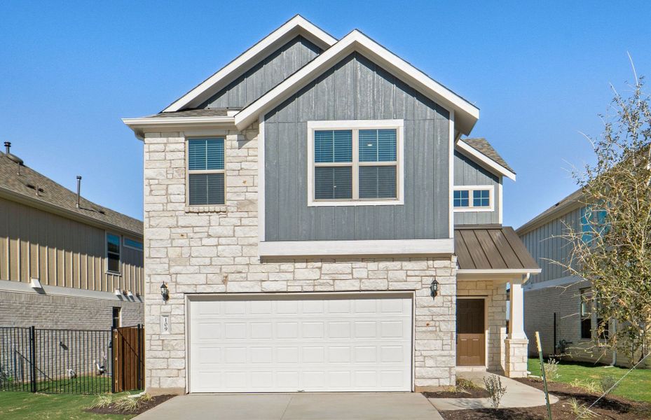 Front exterior of a new home in Santa Rita Ranch, Liberty Hill, TX, highlighting curb appeal (Image 21).