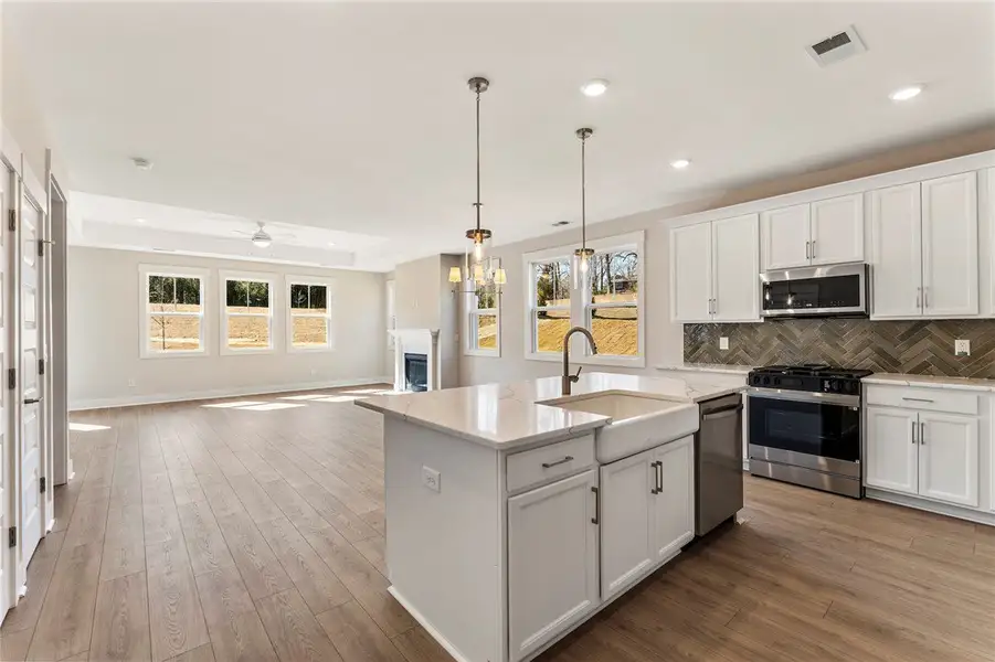 An inviting open-concept kitchen and living area s An inviting open-concept kitchen and living area s