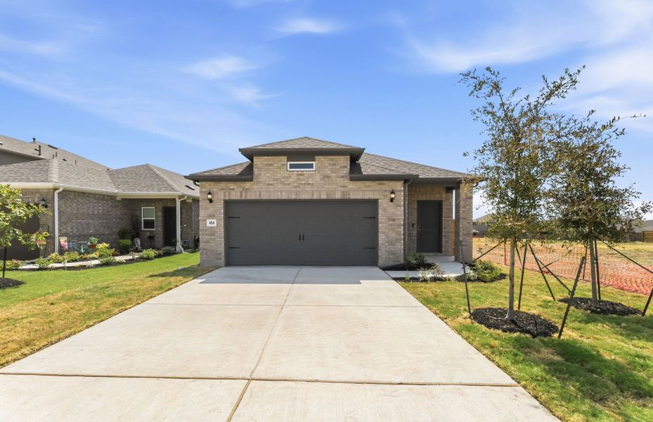 Front exterior of a new home in Crosswinds, Kyle, TX, highlighting curb appeal (Image 19). Front exterior of a new home in Crosswinds, Kyle, TX, highlighting curb appeal (Image 19).