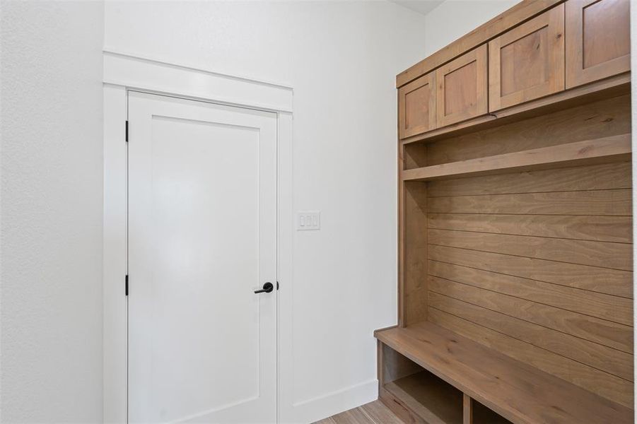 Mudroom with light wood-type flooring