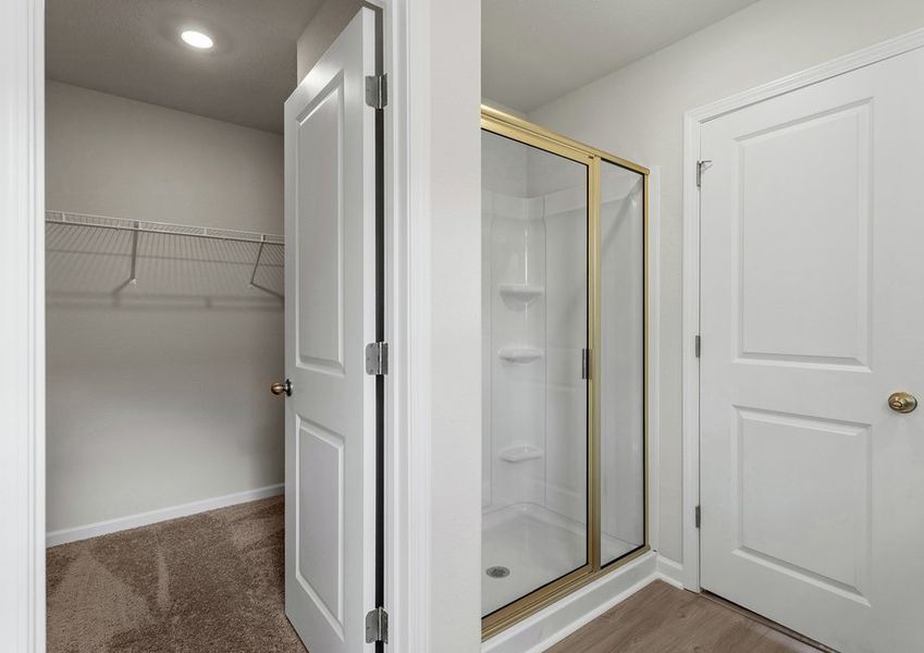 This bathroom has a glass-enclosed shower.