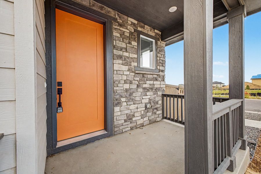 Exterior details and patio area of a home in Painted Prairie, Aurora (Image 3).