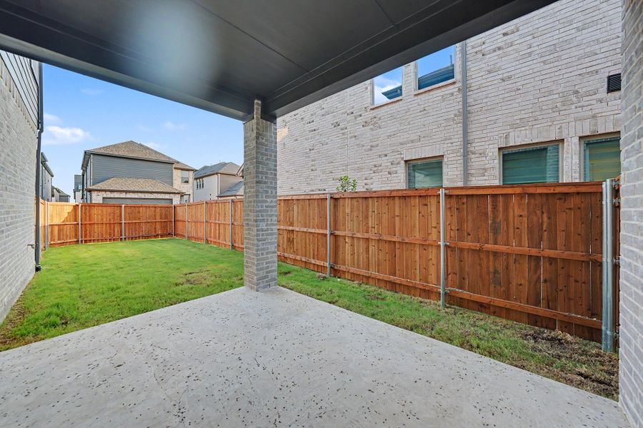 Exterior details and patio area of a home in Light Farms Brenham - 40' Lots, Celina (Image 3).