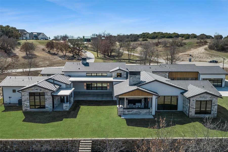 Front exterior of a new home in , Aledo, TX, highlighting curb appeal (Image 27). Front exterior of a new home in , Aledo, TX, highlighting curb appeal (Image 27).