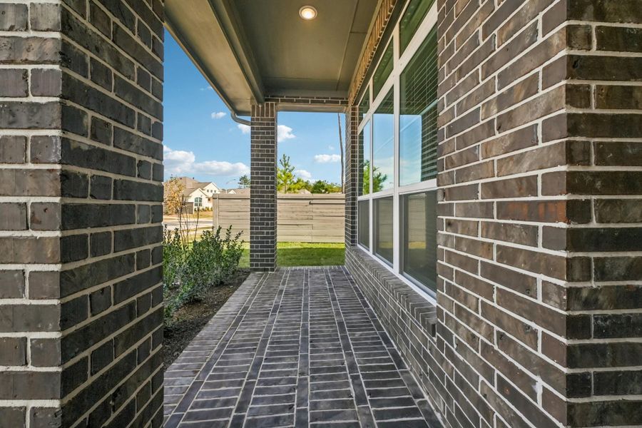 Exterior details and patio area of a home in Artavia, Conroe (Image 28).