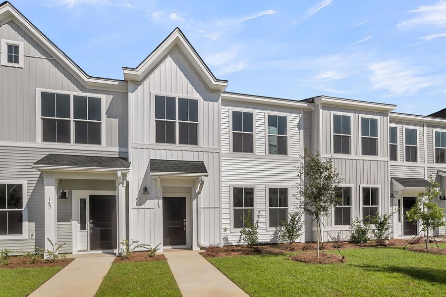 Front exterior of a new home in Six Oaks, Summerville, SC, highlighting curb appeal (Image 1).