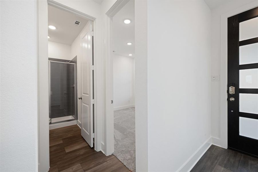 Foyer entrance with dark wood-type flooring