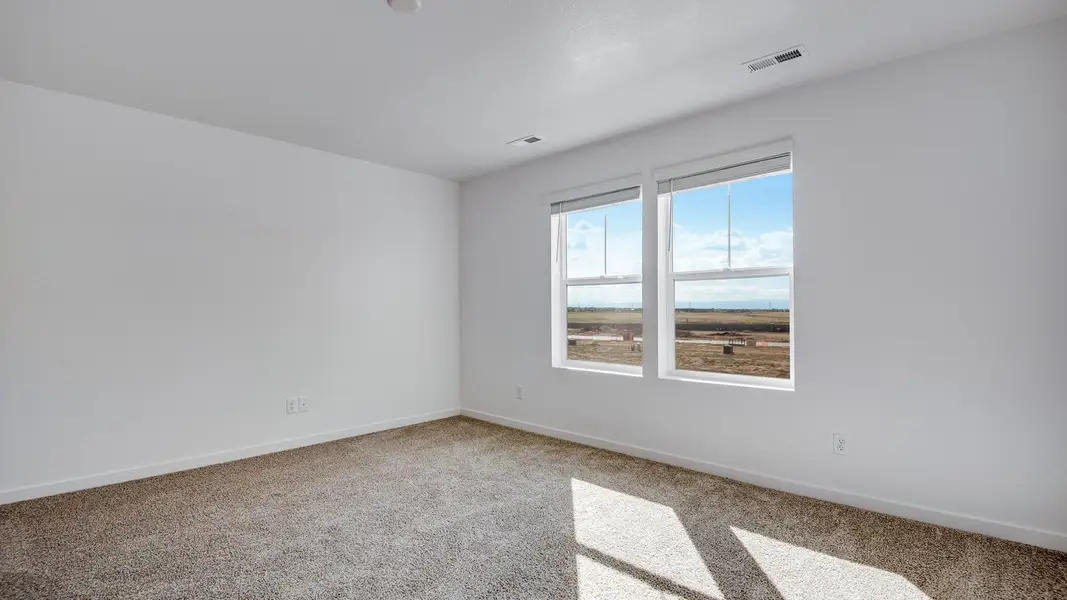 Spacious, unfurnished interior of a new home in Sky Ranch, Watkins (Image 17).