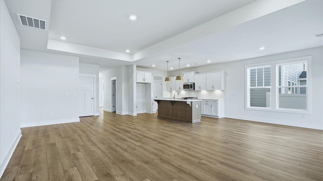 Superior design shines in this open-concept family room with timeless finishes and a modern edge at Mulberry Estates