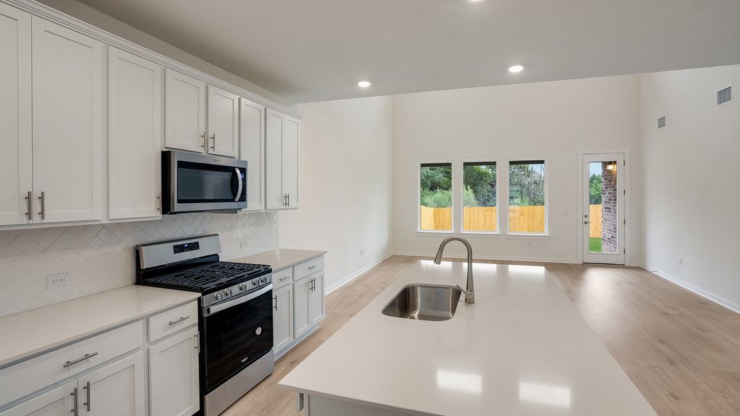 Furnished interior view inside a new home in Prairie Oaks, Oak Point (Image 6).