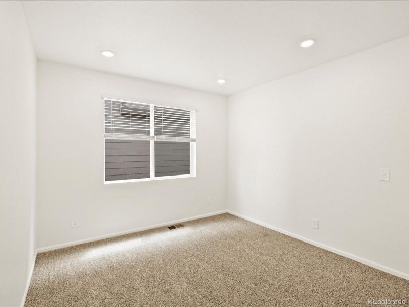 Spacious, unfurnished interior of a new home in Ridgeline Vista: The Flora Collection, Brighton (Image 26).