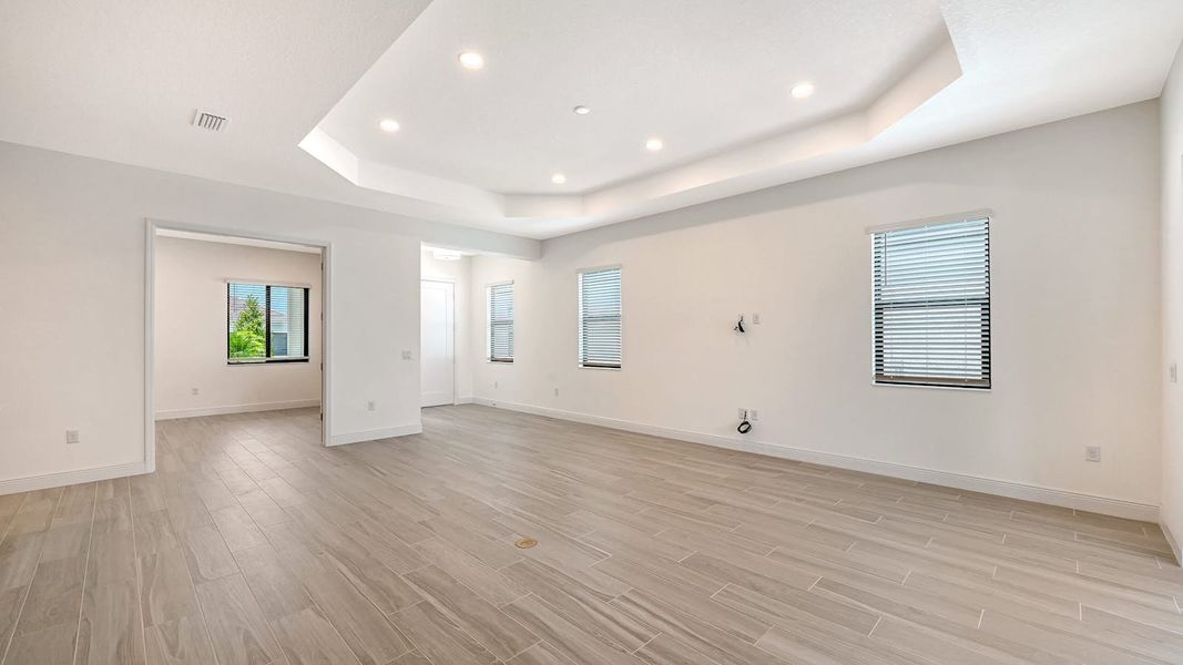 Spacious, unfurnished interior of a new home in Palm Grove Real Estate and Homes for Sale in Lakewood Ranch, FL - Neal Communities, Bradenton (Image 15).