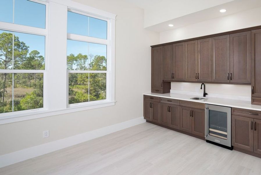 Representative furnished interior of a home built from the Grand Wayfarer by Minto Communities in Latitude Margaritaville Watersound, Panama City Beach (Image 9).