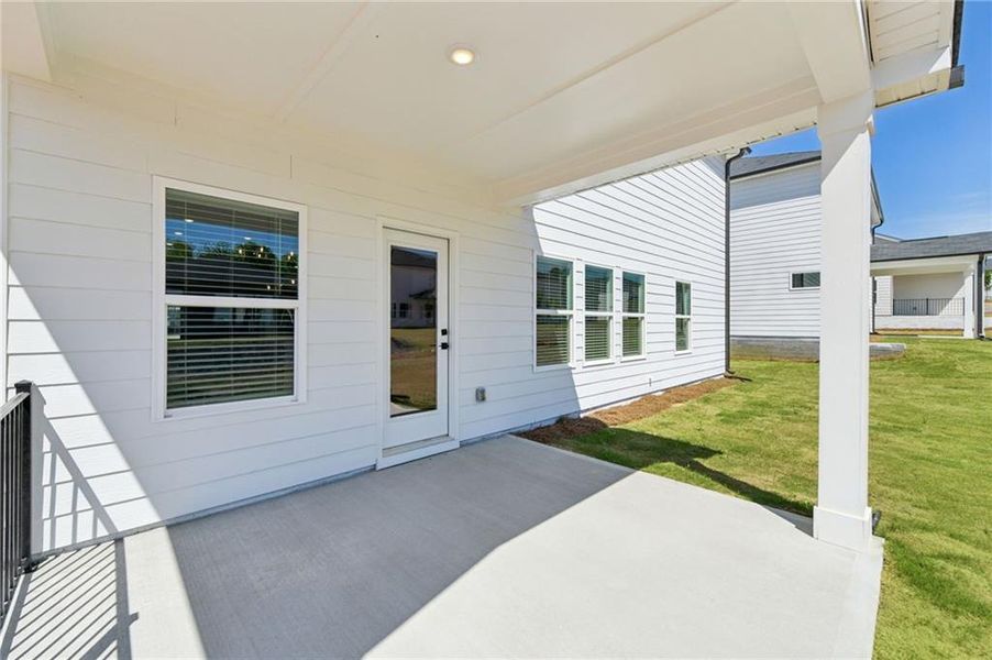 Exterior details and patio area of a home in Vines at Mill Creek - Estate Series, Braselton (Image 29).