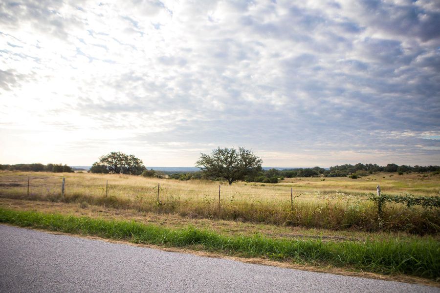 View of asphalt street featuring a view of countryside View of asphalt street featuring a view of countryside
