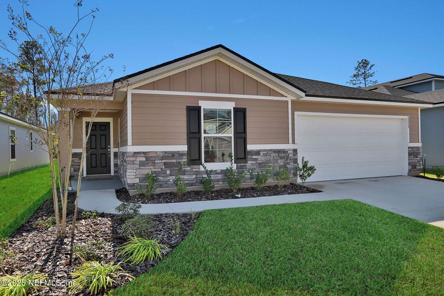 Front exterior of a new home in Wilford Oaks, Orange Park, FL, highlighting curb appeal (Image 24).