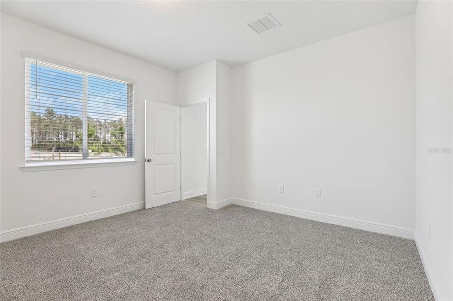 Spacious, unfurnished interior of a new home in Cyrene at Minneola - Villas, Minneola (Image 30).