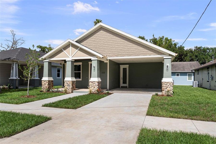 Front exterior of a new home in , Tampa, FL, highlighting curb appeal (Image 19). Front exterior of a new home in , Tampa, FL, highlighting curb appeal (Image 19).
