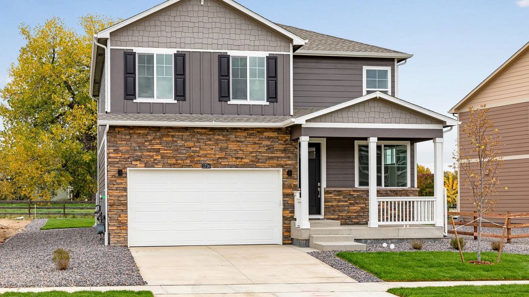 Front exterior of a new home in Vista Meadows, Fort Lupton, CO, highlighting curb appeal (Image 1). Front exterior of a new home in Vista Meadows, Fort Lupton, CO, highlighting curb appeal (Image 1).