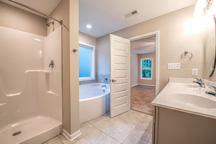 Representative furnished interior of a home built from the Bayhill A by JC Jackson Homes,LLC in Heritage Pointe, Newport (Image 5).
