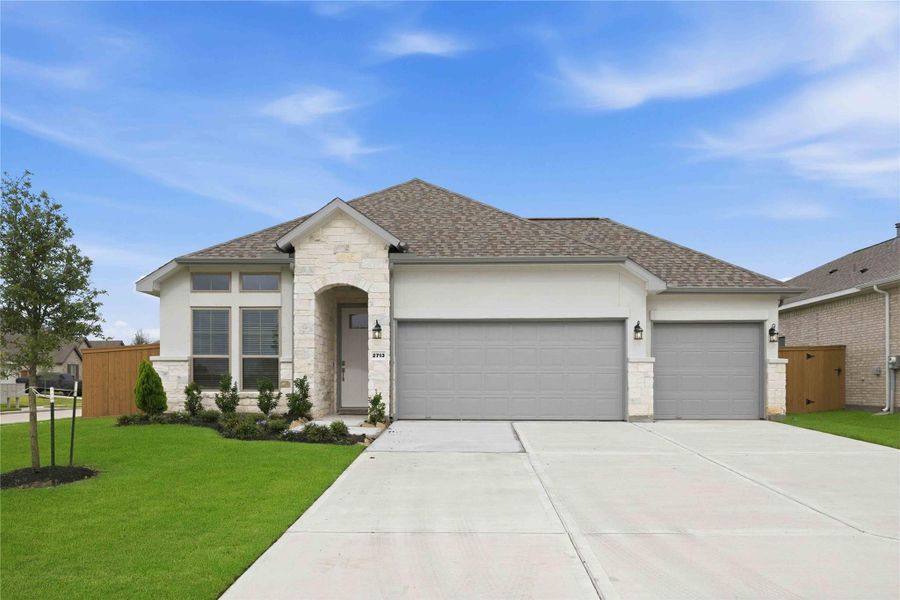 Front exterior of a new home in Lago Mar  50'  &  55', Texas City, TX, highlighting curb appeal (Image 17).