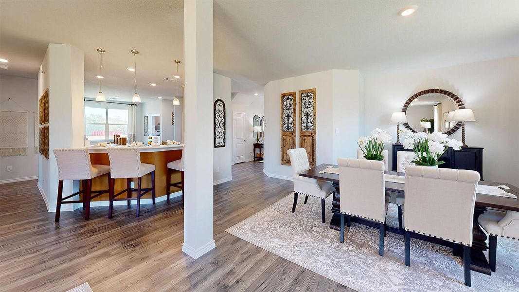 Dining area featuring light wood-style flooring and recessed lighting Dining area featuring light wood-style flooring and recessed lighting