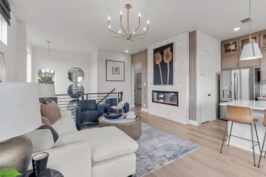 Representative furnished interior of a home built from the Apollo by Chesmar Homes in Centero at Stone Oak, San Antonio (Image 5).