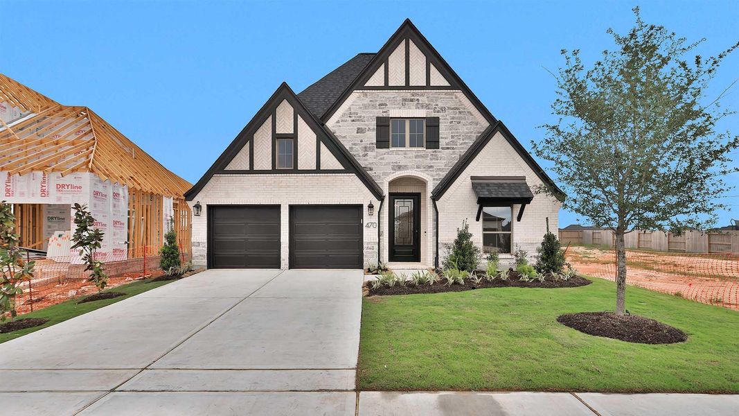 Front exterior of a new home in Grange, Katy, TX, highlighting curb appeal (Image 2).