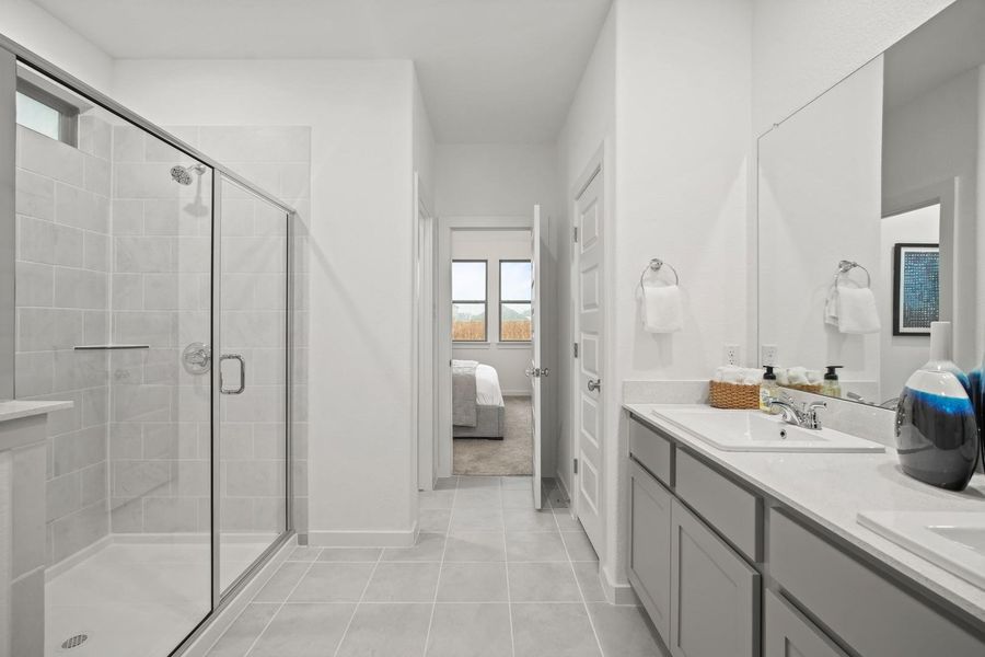 Primary bathroom in the Oak home plan by Trophy Signature Homes – REPRESENTATIVE PHOTO