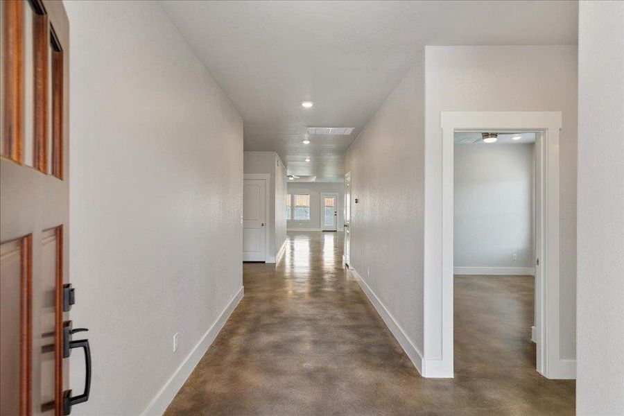High ceilings, great lighting, and sleek concrete floors greet you as you step inside the home. High ceilings, great lighting, and sleek concrete floors greet you as you step inside the home.
