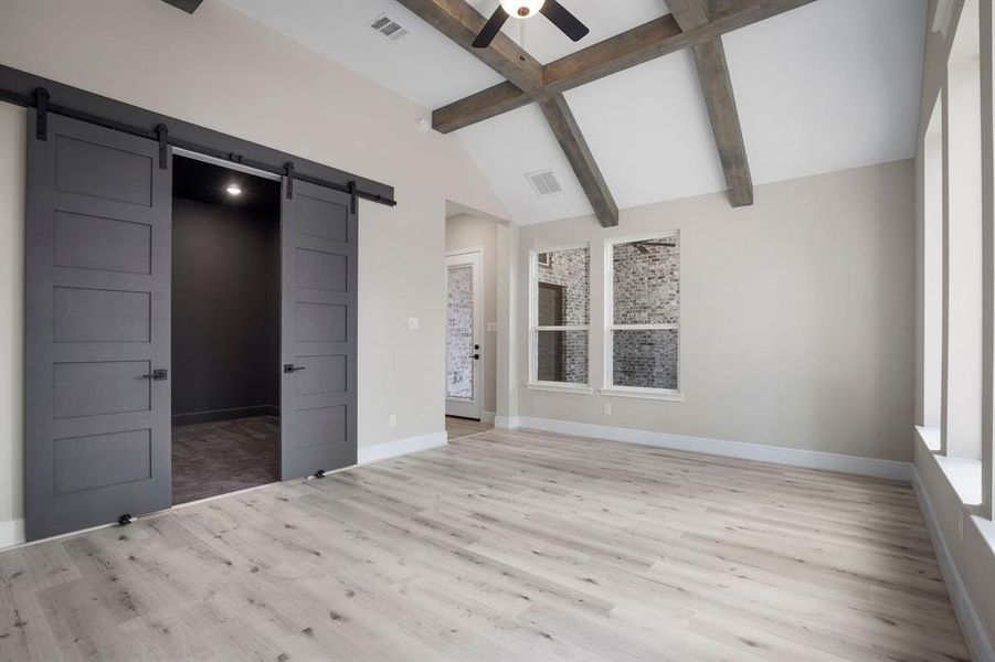 Gameroom with barn door entry to media room