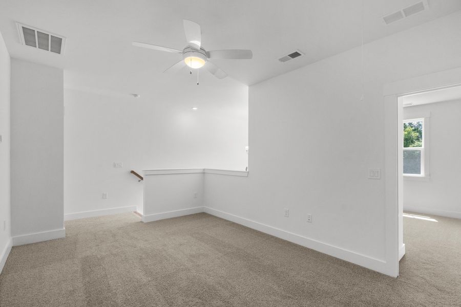 Spacious, unfurnished interior of a new home in Long Bay Golf Club, Longs (Image 32).