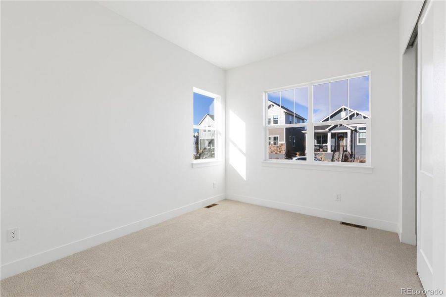 Spacious, unfurnished interior of a new home in Dillon Pointe - Journey, Broomfield (Image 32).