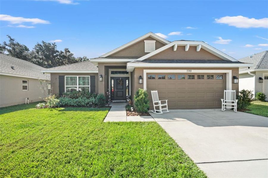 Front exterior of a new home in Wyld Palms, Inverness, FL, highlighting curb appeal (Image 1). Front exterior of a new home in Wyld Palms, Inverness, FL, highlighting curb appeal (Image 1).