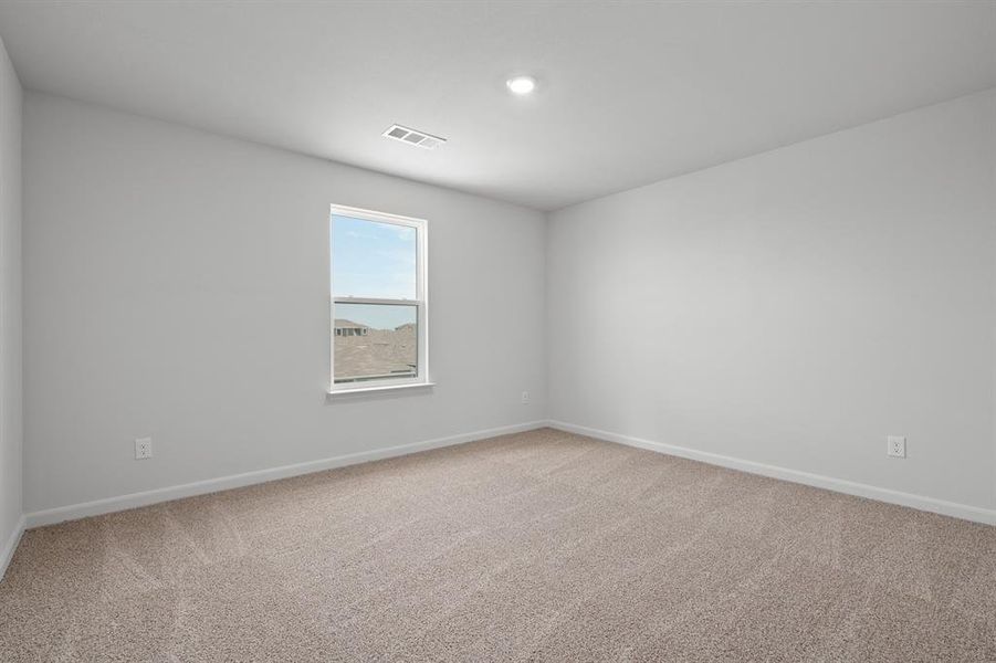 Empty room featuring light colored carpet Empty room featuring light colored carpet