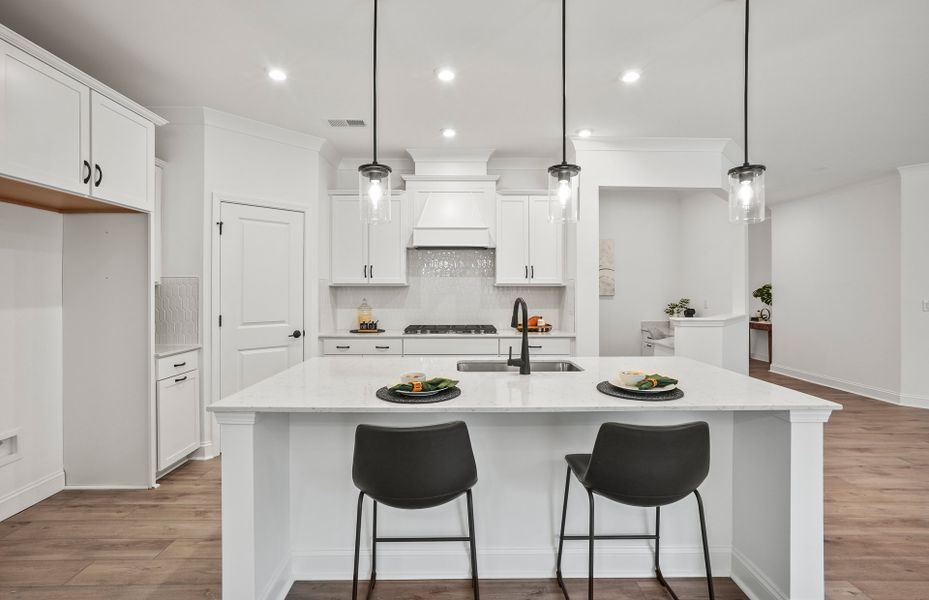 Bright Open Kitchen with Large Island and Café