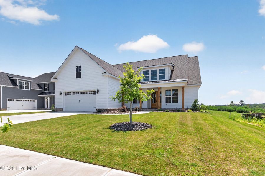 Front exterior of a new home in Highland Lakes, Evans, GA, highlighting curb appeal (Image 30).