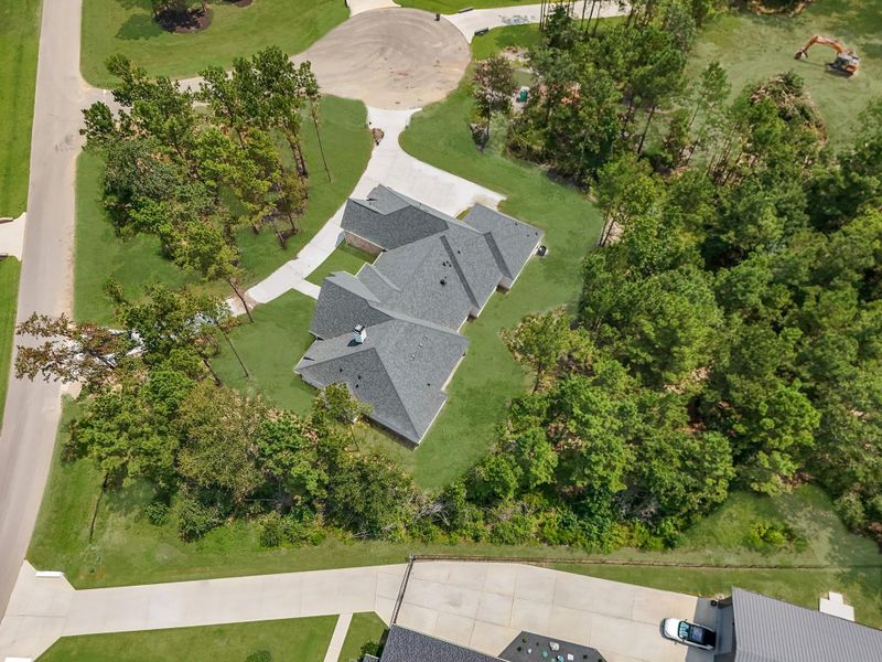 Front exterior of a new home in , Montgomery, TX, highlighting curb appeal (Image 25). Front exterior of a new home in , Montgomery, TX, highlighting curb appeal (Image 25).
