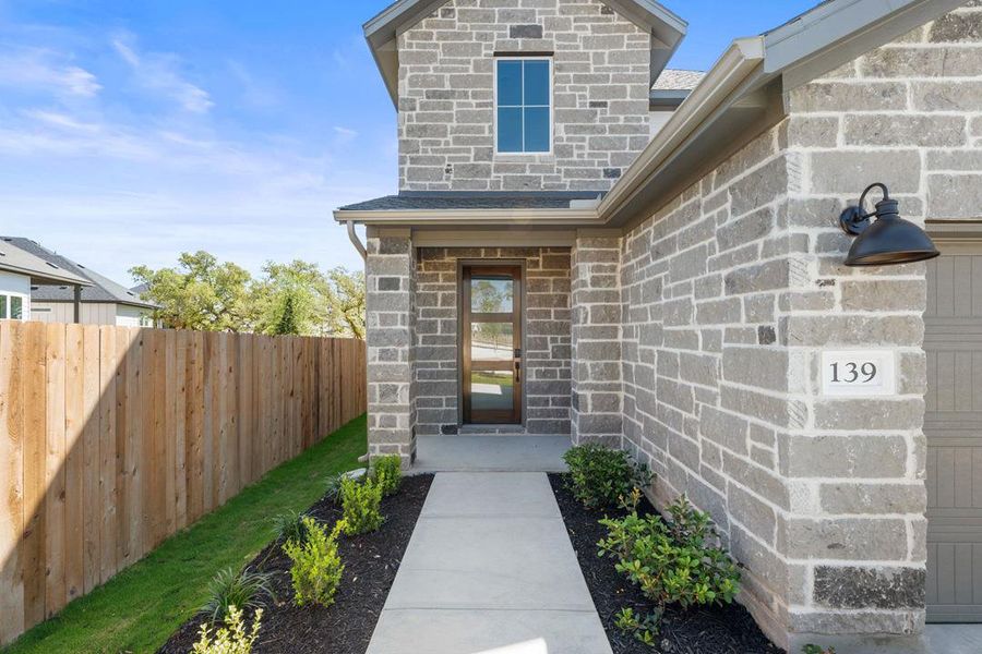 Exterior details and patio area of a home in Heritage, Dripping Springs (Image 25).