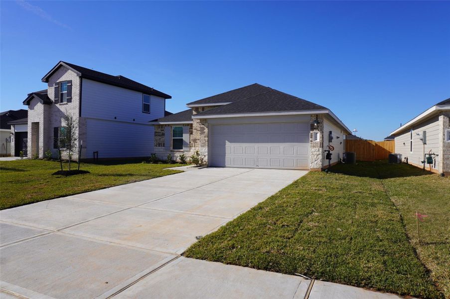 Front exterior of a new home in , Fulshear, TX, highlighting curb appeal (Image 9).