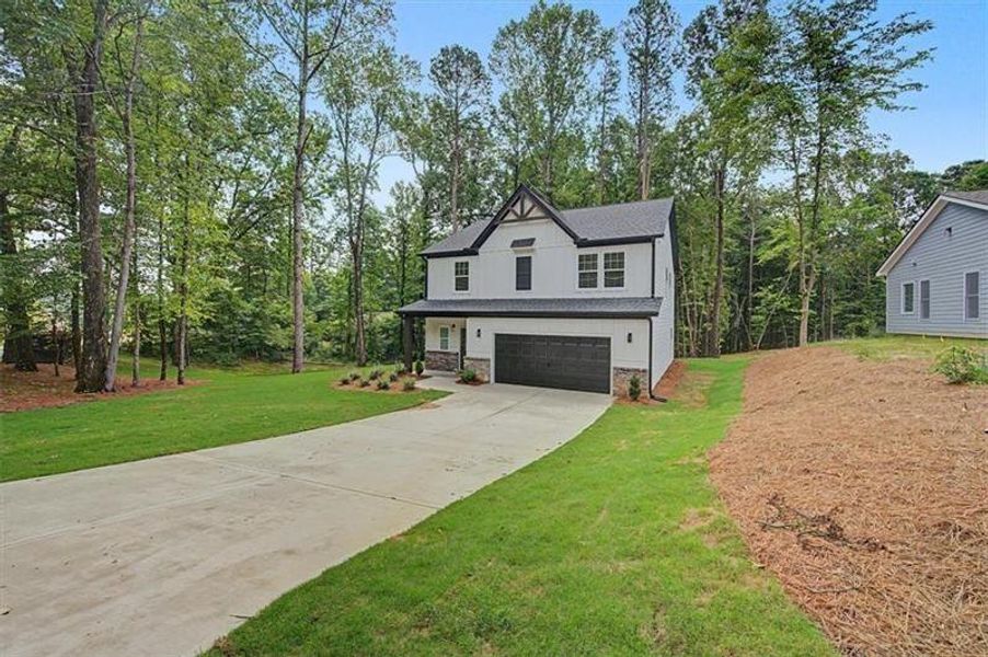 Front exterior of a new home in , Canton, GA, highlighting curb appeal (Image 27). Front exterior of a new home in , Canton, GA, highlighting curb appeal (Image 27).