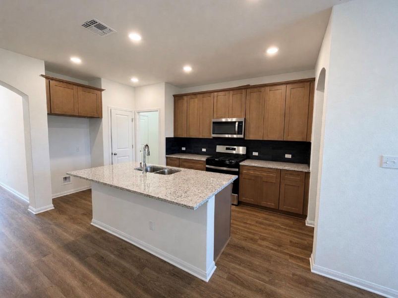 Furnished interior view inside a new home in Wellspring, Round Rock (Image 5).