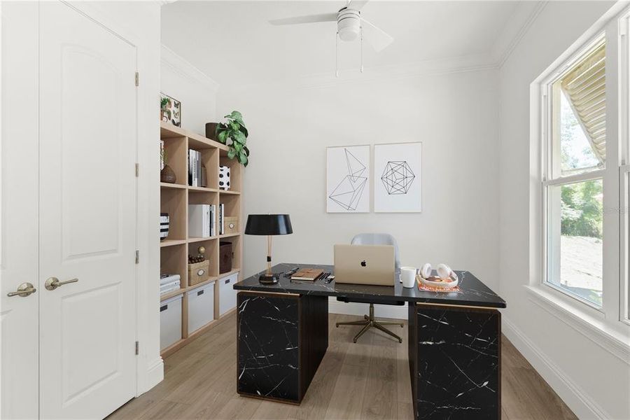 Versatile room, staged as a home office, but easily adaptable as an additional bedroom, featuring a large window for natural light.