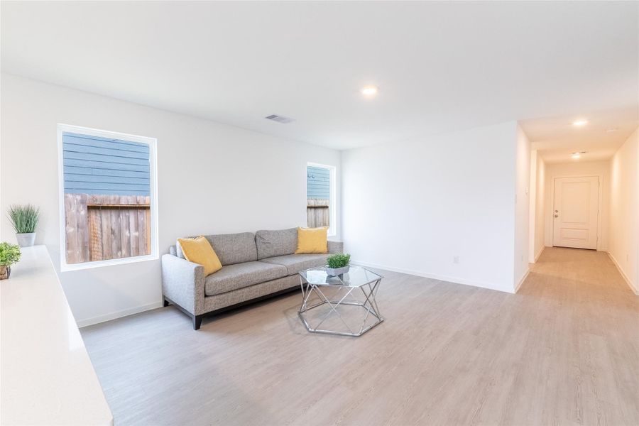 The living room offers a voluminous amount of space for a large sectional and entertainment center. The living room offers a voluminous amount of space for a large sectional and entertainment center.