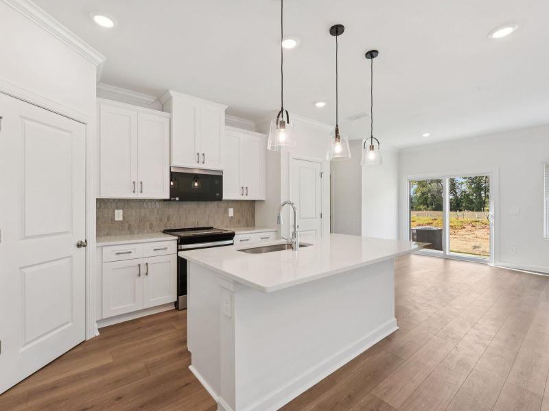 Turn the oversized kitchen island into a bar counter for additional seating. Turn the oversized kitchen island into a bar counter for additional seating.