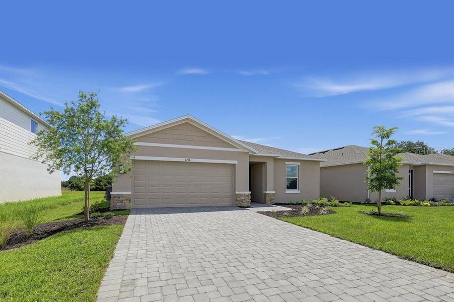 Front exterior of a new home in Solena, North Fort Myers, FL, highlighting curb appeal (Image 27).
